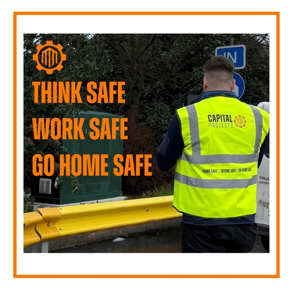 Worker in high-vis vest with Think Safe Work Safe Go Home Safe message