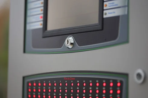Close-up of a fire alarm control panel