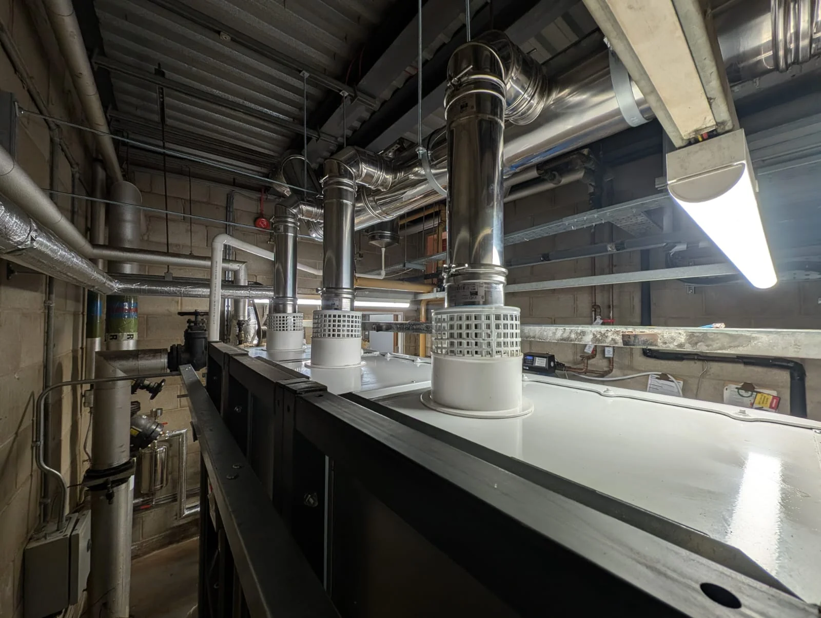 Mechanical plant room with flues and pipework
